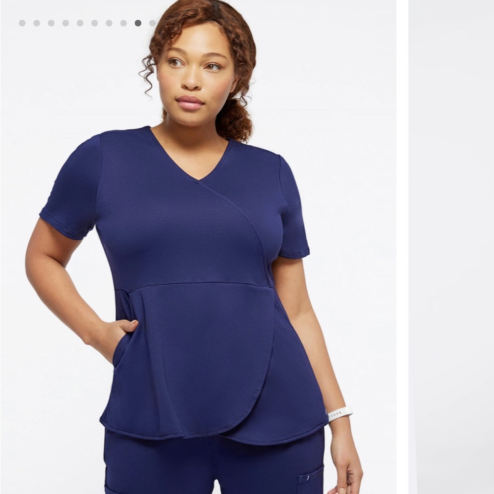 Jaanuu tailored spinryx tulip mock-wrap scrub top